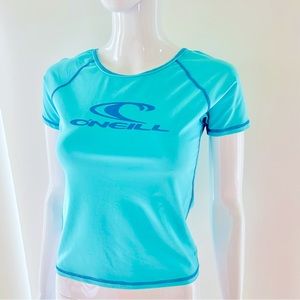 O’Neill turquoise blue cap sleeve cropped tee shirt rash guard. Size Medium.
